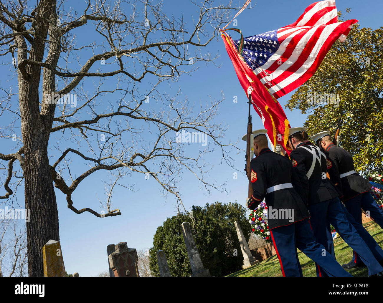 U.S. Marines with Marine Corps Base Quantico Color Guard march on the colors for the Presidential wreath laying ceremony held to honor the 4th President of the United States, James Madison, also known as the Father of the Constitution, at his home at Montpelier, Orange, Va., March 16, 2018. This event was held in commemoration of the 267th anniversary of the birth of Madison, born in 1751, and has also been decreed as James Madison Appreciation Day for the Commonwealth of Virginia. Armed Forces and civilians displaying courage bravery dedication commitment and sacrifice Stock Photo