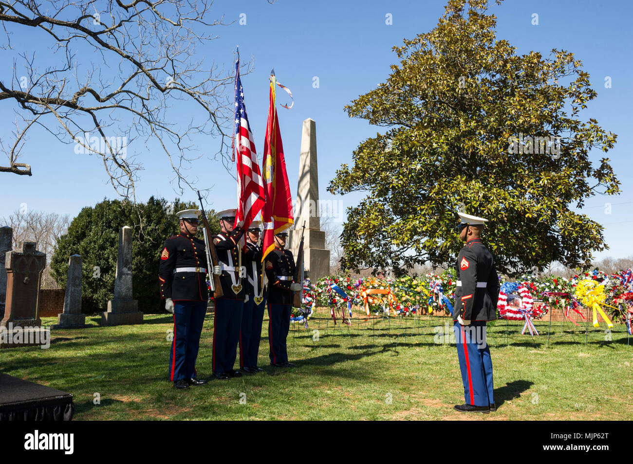 U.S. Marines with Marine Corps Base Quantico Color Guard present the colors for the Presidential wreath laying ceremony held to honor the 4th President of the United States, James Madison, also known as the Father of the Constitution, at his home at Montpelier, Orange, Va., March 16, 2018. This event was held in commemoration of the 267th anniversary of the birth of Madison, born in 1751, and has also been decreed as James Madison Appreciation Day for the Commonwealth of Virginia. Armed Forces and civilians displaying courage bravery dedication commitment and sacrifice Stock Photo
