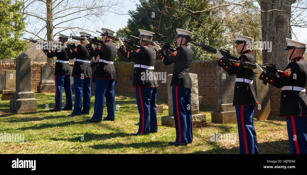 U.S. Marines with Marine Corps Base Quantico Ceremonial Platoon provide a 21-gun salute during the Presidential wreath laying ceremony honoring the 4th President of the United States, James Madison, also known as the Father of the Constitution, at his home at Montpelier, Orange, Va., March 16, 2018. This event was held in commemoration of the 267th anniversary of the birth of Madison, born in 1751, and has also been decreed as James Madison Appreciation Day for the Commonwealth of Virginia. Armed Forces and civilians displaying courage bravery dedication commitment and sacrifice Stock Photo