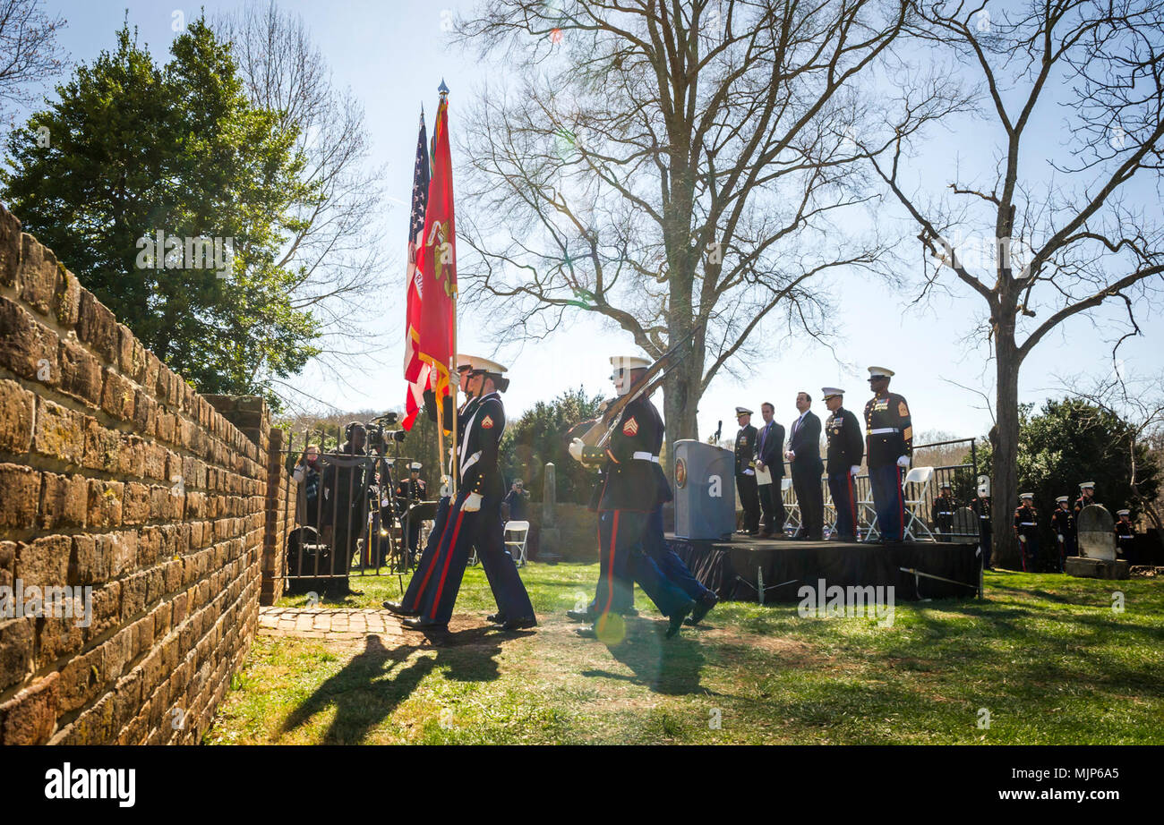 U.S. Marines with Marine Corps Base Quantico Color Guard retire the colors after the Presidential wreath laying ceremony held to honor the 4th President of the United States, James Madison, also known as the Father of the Constitution, at his home at Montpelier, Orange, Va., March 16, 2018. This event was held in commemoration of the 267th anniversary of the birth of Madison, born in 1751, and has also been decreed as James Madison Appreciation Day for the Commonwealth of Virginia. Armed Forces and civilians displaying courage bravery dedication commitment and sacrifice Stock Photo