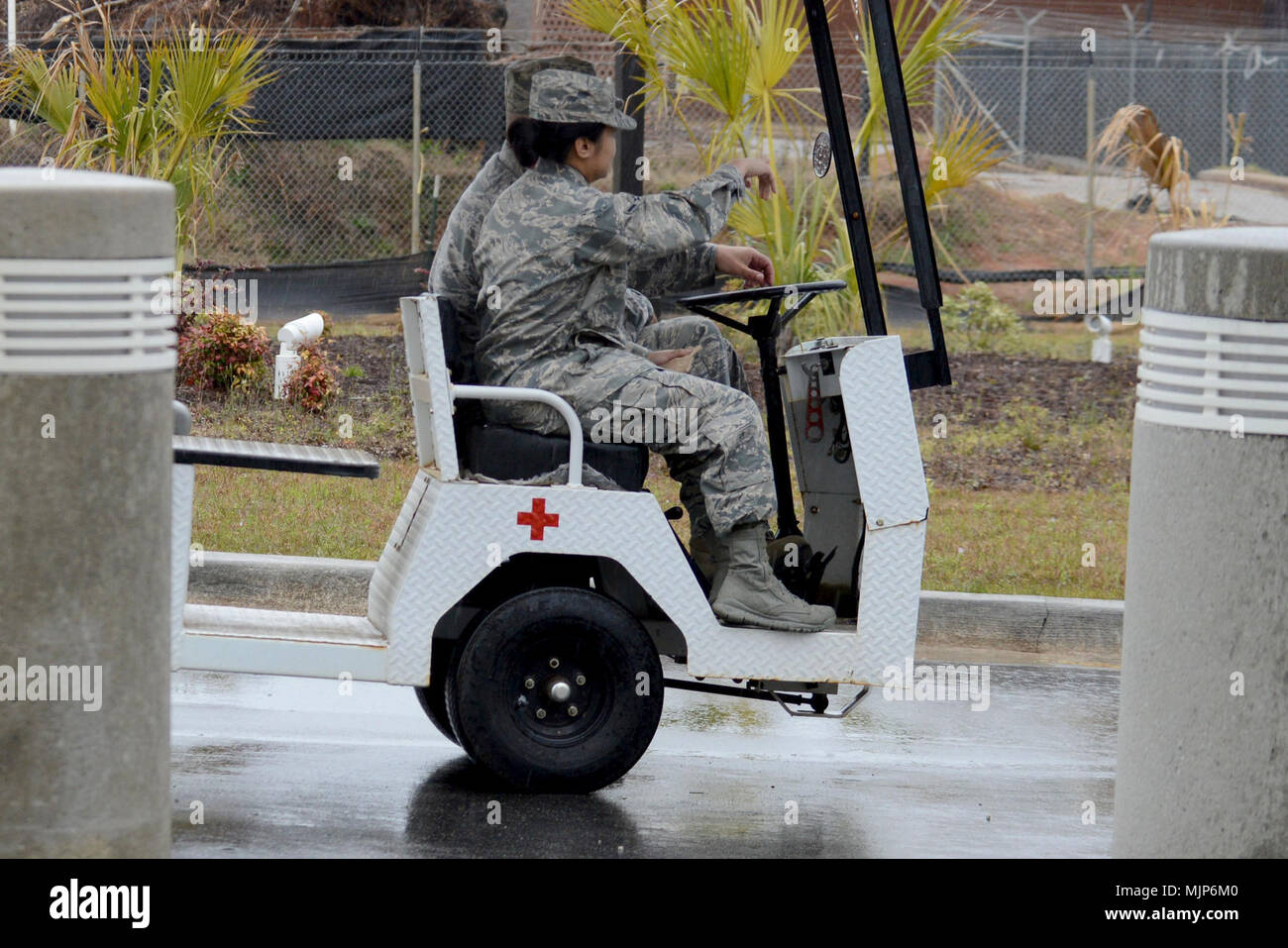 U.S. Air Force Tech. Sgt. Brian Londo, 20th Medical Group (MDG) medical logistics warehouse noncommissioned officer in charge, drives a Team Shaw Airman to the 20th MDG staff parking lot using the patient shuttle golf cart at Shaw Air Force Base, S.C., March 19, 2018. The 20th MDG golf cart is scheduled to operate all year. Armed Forces and civilians displaying courage bravery dedication commitment and sacrifice Stock Photo