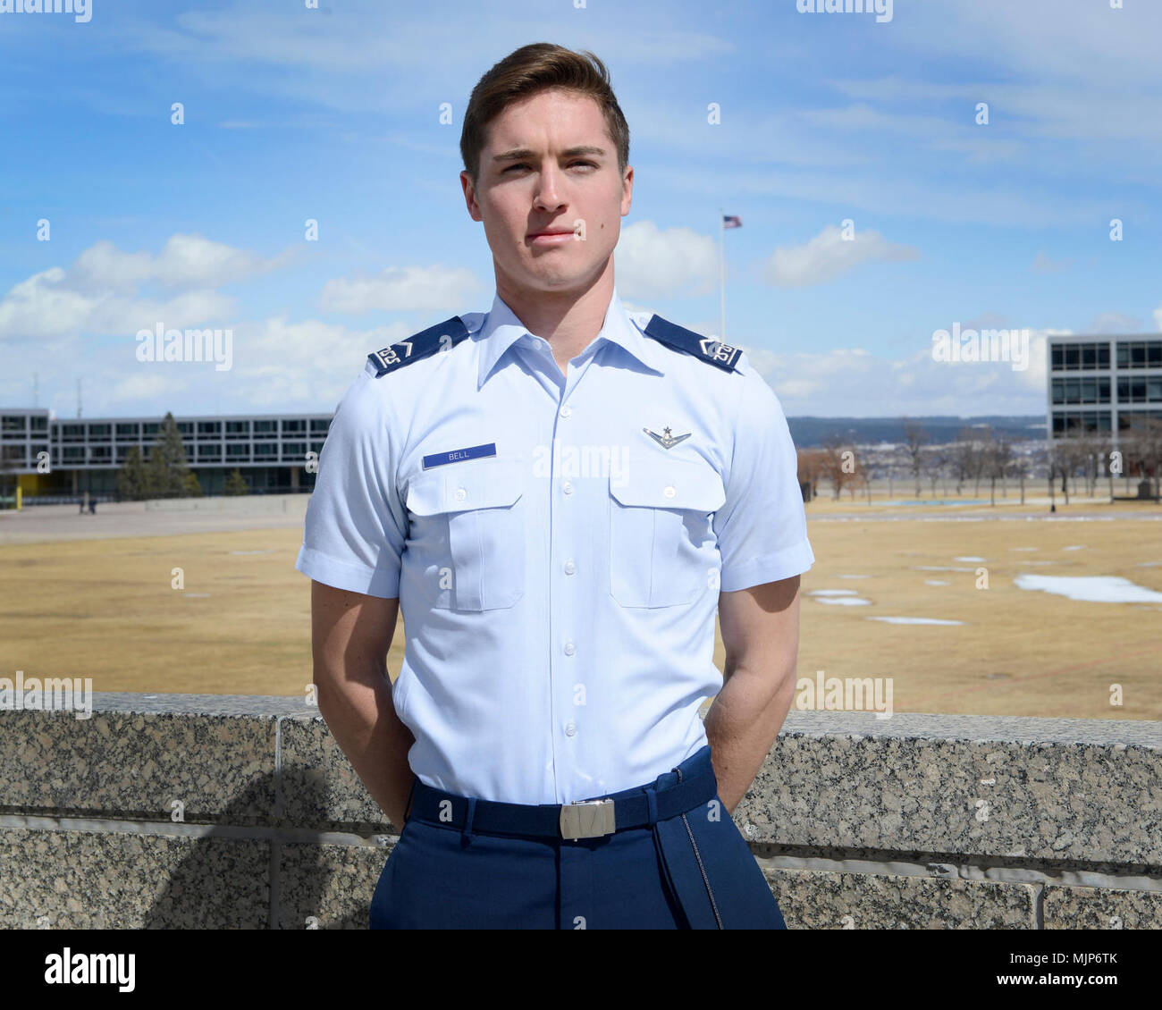 Cadet 3rd Class Jack Bell, Cadet Squadron 29, poses for a photo on the Terrazzo at the U.S. Air Force Academy, Colo., March 19, 2018. In the span of 72 hours, Bell talked a suicidal man off a Colorado Springs overpass and helped air traffic controllers in Northern California locate a downed aircraft. Armed Forces and civilians displaying courage bravery dedication commitment and sacrifice Stock Photo