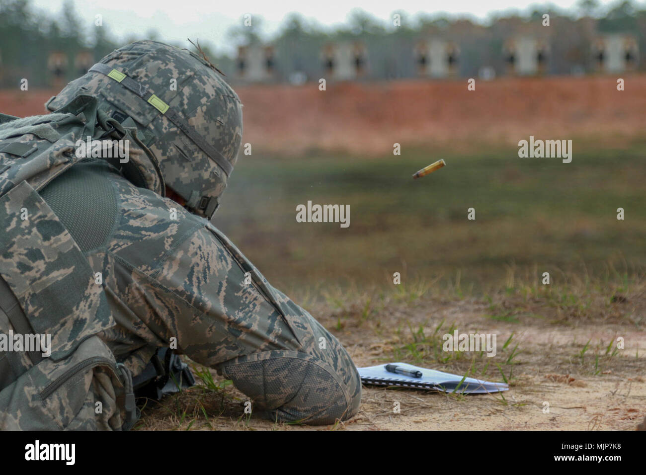 Fort Stewart, Ga., March 20, 2018 - Georgia Air National Guardsman Senior Master Sgt. David Taylor, security forces, 165th Security Forces Squadron, Savannah, Ga., engages a 100-meter target during the Georgia Army National Guard Small Arms Leader Course. The course specilizes in the tactics and techniques of engagement and training Guardsman in weapons use.  (Georgia Army National Guard Armed Forces and civilians displaying courage bravery dedication commitment and sacrifice Stock Photo