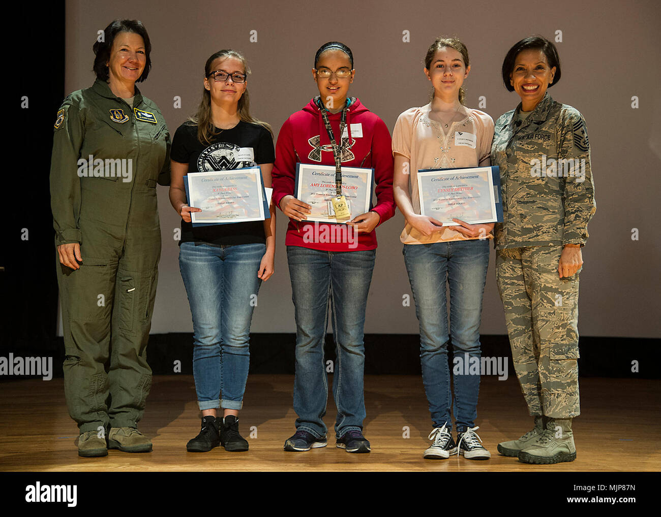 315th Airlift Wing Vice Commander, Col. Jeanine McAnaney (left) and Air Force Reserve Command Chief Ericka Kelly (right) stand with the winners of the Joint Base Charleston Women in Aviation Scholarship Essay contest (from right)  Lynsey Dethier, 1st place, Amy Lorentzos-Lobo, 2nd place, and Kayla Lass, 3rd place, at the JBC WIA Career Day here, March 20. Armed Forces and civilians displaying courage bravery dedication commitment and sacrifice Stock Photo