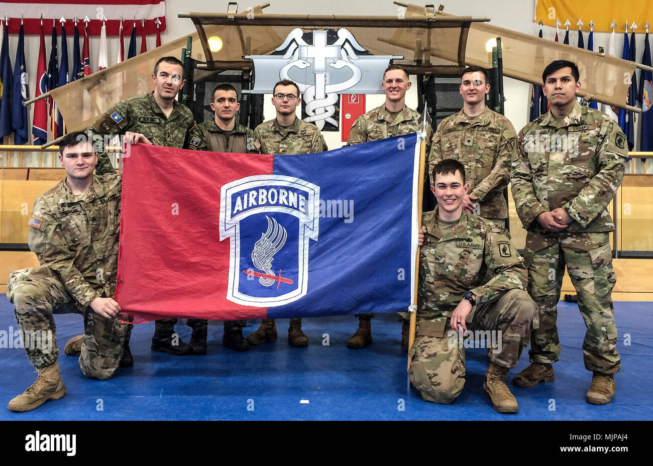 Two Allied Soldiers from Kosovo worked with the six medics from the 173rd Airborne Brigade to earn the Expert Field Medical Badge during testing at Grafenwoehr, Germany.  Those receiving the EFMB were Sgt. Jacob Shepherd, Cpl. Besart Ejupi, Cpl. Kushtrim Hyseni, Sgt. Brenden Lee, Spc. Kyle Daron, Spc. Matthew Holtz, Sgt. Angel Gomez  and Pfc. Jonah Petrick. Armed Forces and civilians displaying courage bravery dedication commitment and sacrifice Stock Photo