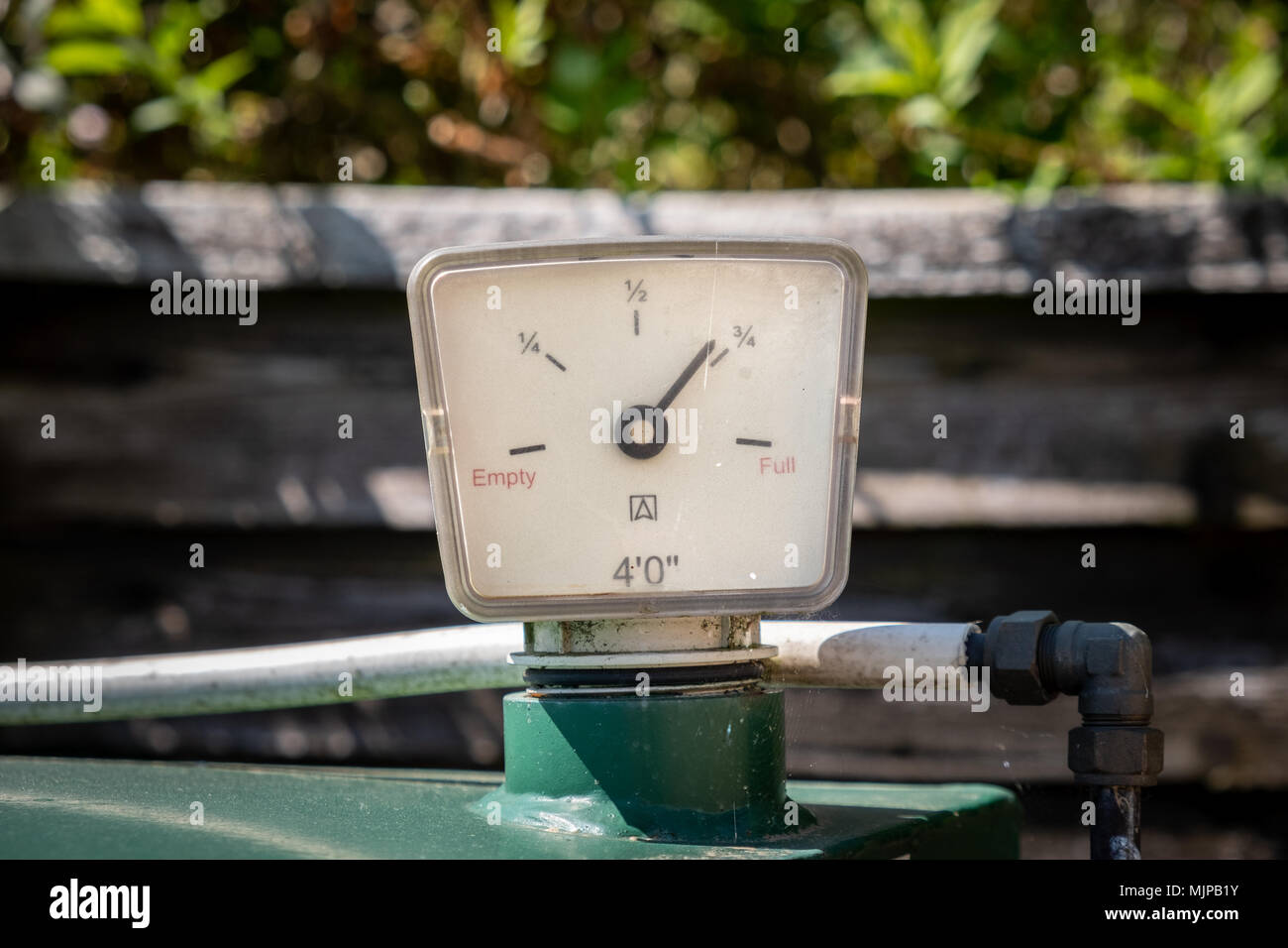 Domestic heating oil tank gauge shwoing almost three quarters full. Stock Photo
