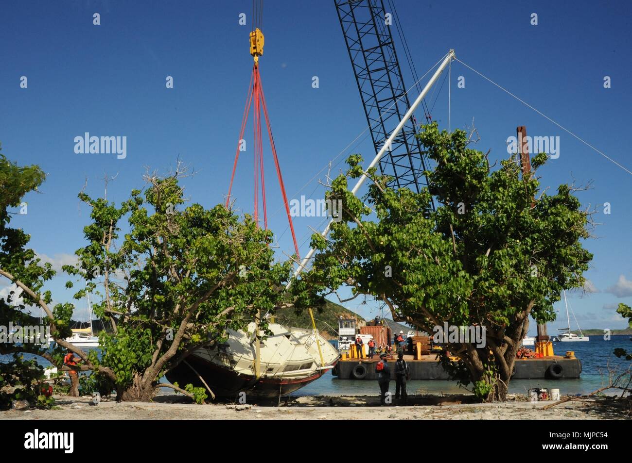 Response personnel perform the lift of the sailing vessel Citadel near