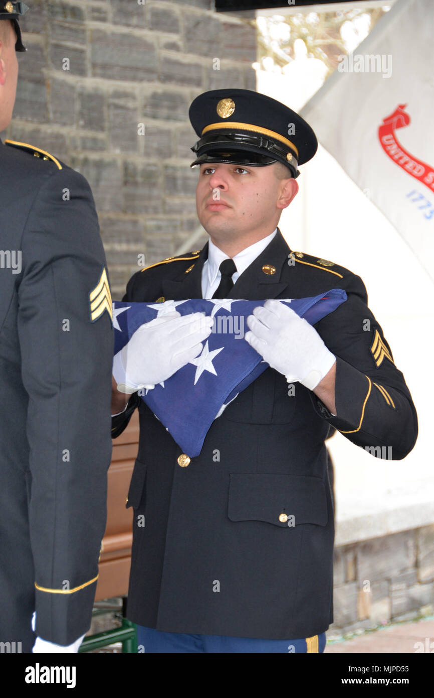 New York Army National Guard Sgt Ramon Rodriguez Folds A U S Flag 