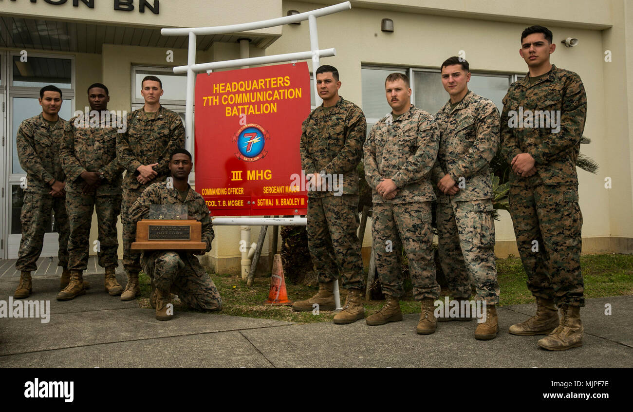 Marines with 7th Communication Battalion, III Marine Expeditionary Force Information Group, III MEF, brought home the Lloyd Memorial Trophy, Dec. 19, 2017, after the annual pacific division shooting matches held at Camp Hansen, Okinawa, Japan. It has been 40 years since the unit last won the trophy. Members of the team from left to right include: Cpl. Fernando Aguirre, Cpl. Melvon Davis, 1st Lt. Jeff Womelsdorf, Cpl. Mustafa Shabazz, 1st Lt. Nelson Lovos, Sgt. Nolan Peck, Sgt. Logan Maar, and Cpl. Alfredo Garciarodriguez. Gunnery Sgt. Justin Santiago, the only team member not depicted, was awa Stock Photo