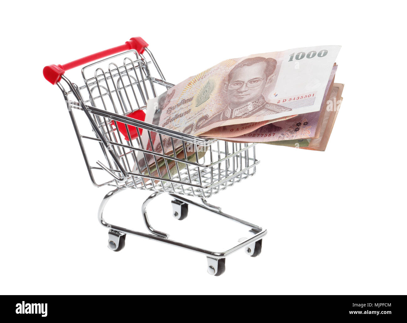 Shoppingcart filled with Tahi baht banknotes, isolatedon white. Stock Photo
