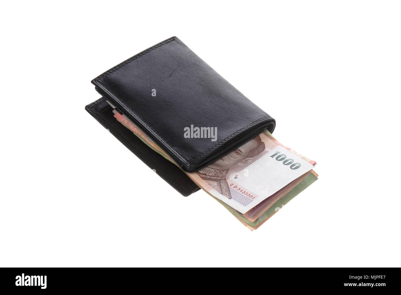 Thai baht banknotes inside a black wallet isolated on black. Stock Photo