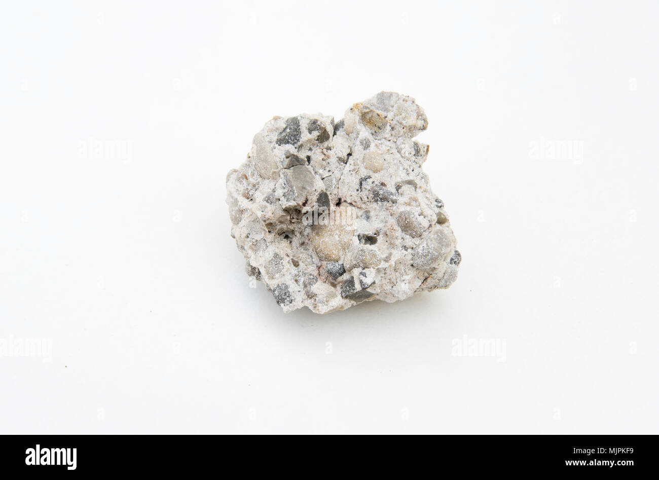 extreme close up with a lot of details of conglomerate rock isolated ...