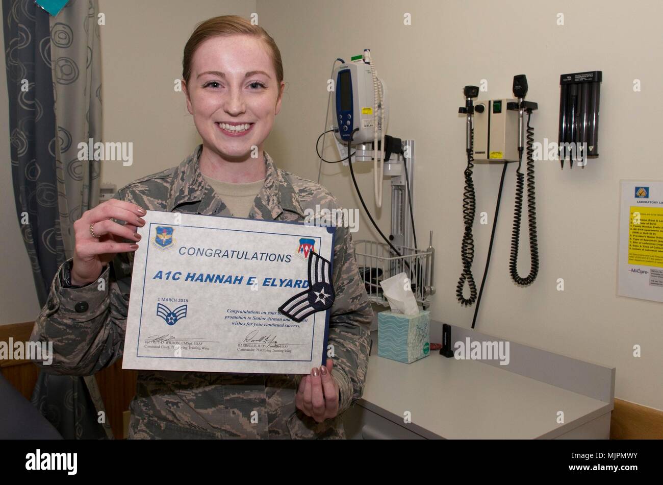 Airman 1st Class Hannah Elyard, a pediatrics medical technician in the 71st Medical Operations Squadron, 71st Medical Group, 71st Flying Training Wing, Vance Air Force Base, Oklahoma, holds her certificate of promotion to Senior Airman Dec. 21 at the Vance Clinic. Elyard, a Bedford, Pennsylvania, native, was select to be promoted to Senior Airman Below the Zone which allows an Air Force E-3 to sew on E-4 six months early. (U.S. Air Force photo by Tech. Sgt. James Bolinger) Stock Photo