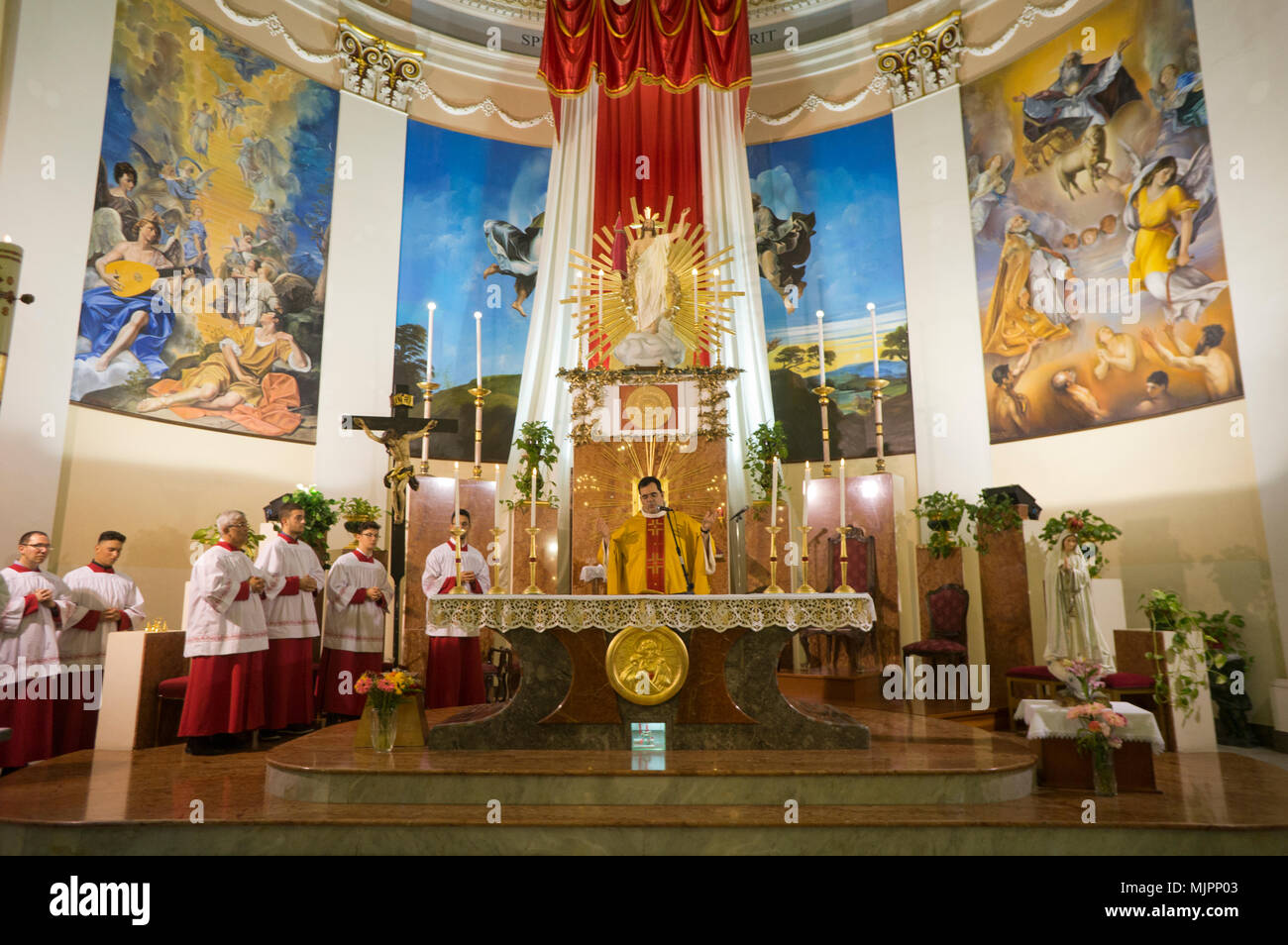 Priest celebrating Mass in a Catholic church in Palermo, Sicily, Italy Stock Photo