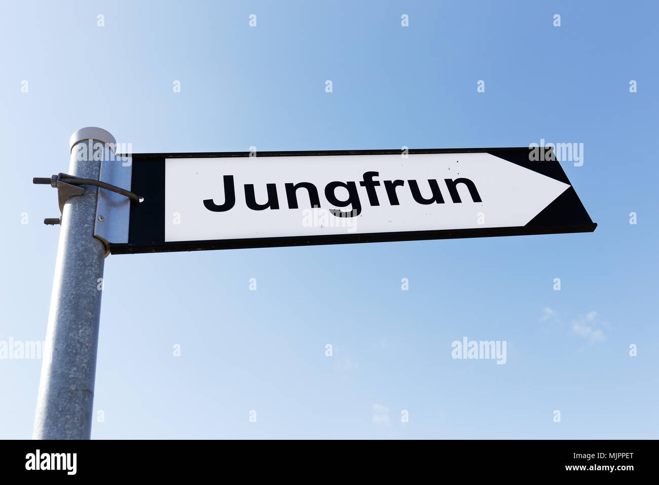 Signpost directing to the sea stack named Jungfrun (Virgin) in Lickerhamn on tre Swedish island Gotland. Stock Photo