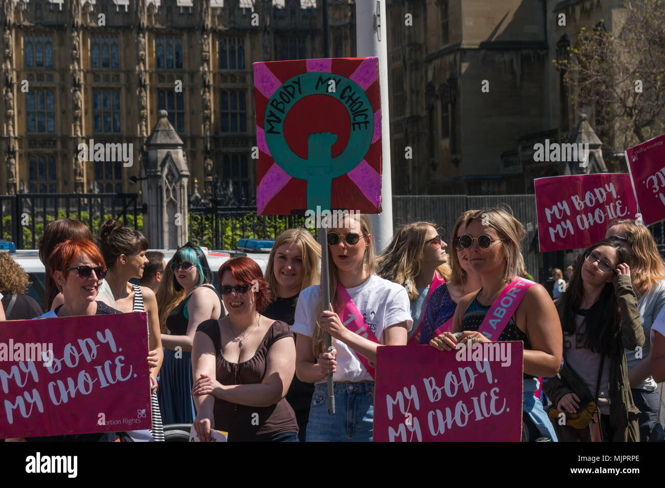 London, UK. 5th May 2018. Women in the abortion rights campaign hold posters and a placard 'My Body My Choice' at a rally in Parliament Square before the annual March for Life UK by pro-life anti-abortion campaigners was to march to a rally there. They insisted on the right for women to choose and opposed to any increase of restrictions which would lead to the problems we saw before the 1967 Abortion Act, when women risked their lives in back street abortions. They called for women in Northern Ireland to be given the same rights as in the rest of the UK and for an end of the harassment of wome Stock Photo