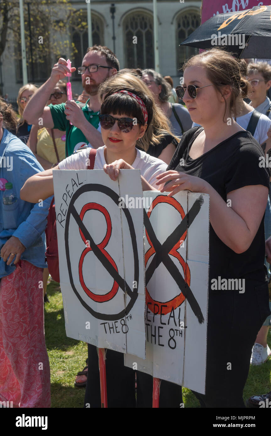 London, UK. 5th May 2018. Women in the abortion rights campaign hold posters calling for the repeal of the Irish 8th amendment against abortion at a rally in Parliament Square before the annual March for Life UK by pro-life anti-abortion campaigners was to march to a rally there. They insisted on the right for women to choose and opposed to any increase of restrictions which would lead to the problems we saw before the 1967 Abortion Act, when women risked their lives in back street abortions. They called for an end of the harassment of women going into clinics, and for women in Northern Irelan Stock Photo