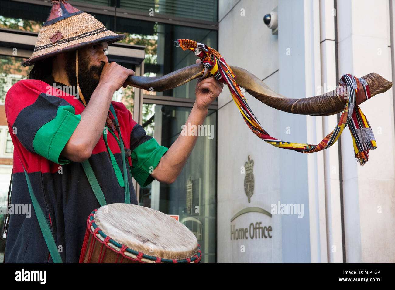 London, UK. 5th May, 2018. Asheber sounds a horn during a protest outside the Home Office by activists from Stand Up To Racism and supporters of the Windrush generation calling for the scrapping of the 2014 Immigration Act. Credit: Mark Kerrison/Alamy Live News Stock Photo