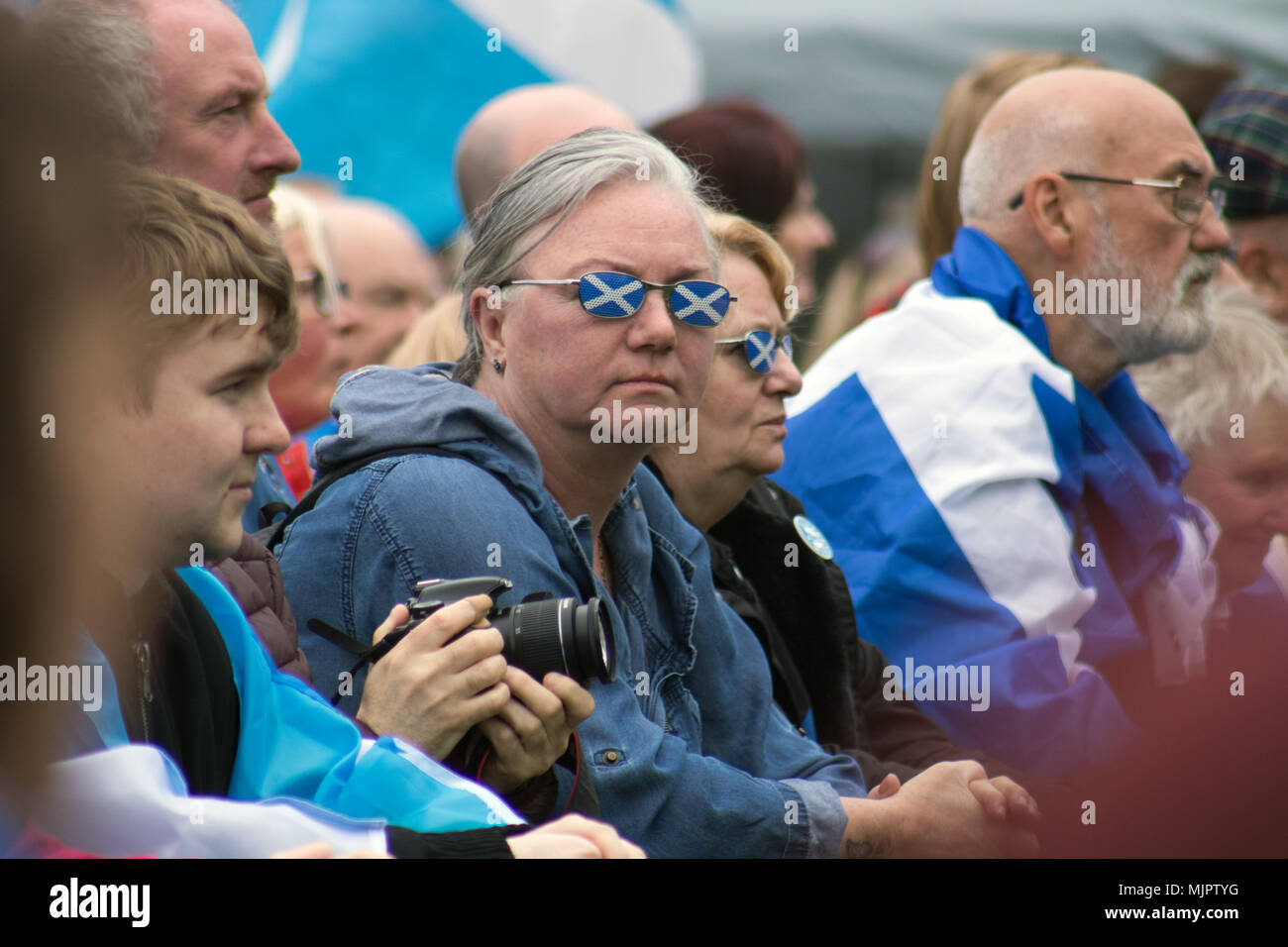 Glasgow, Scotland, UK. 5th May, 2018. March for Independence has taken place in Glasgow, with demonstrators travelling from Kelvingrove Park, through the West End and into the city centre, and finally arriving at Glasgow Green, where there was a stage with political speakers and entertainment. People of all ages were draped in Saltires and waving their flags. According to Police Scotland, an estimated 35,000 pro-Indy supporters took part. The organisers, All Under One Banner (AUOB), claim an even higher figure. Iain McGuinness / Alamy Live News Stock Photo