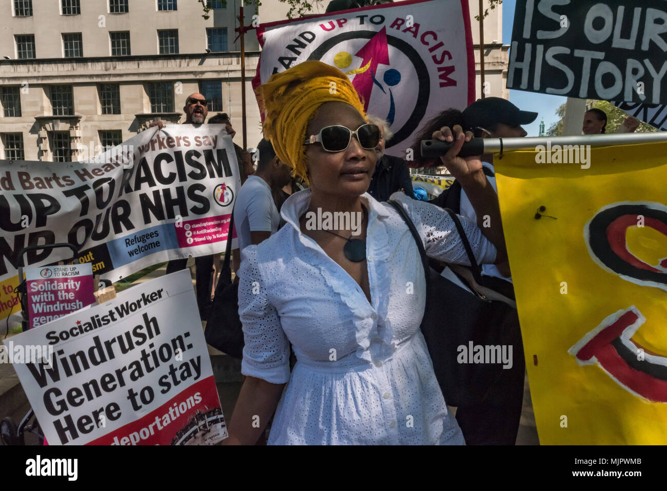 London, UK. 5th May 2018. Stand Up To Racism hold a rally at Downing St calling for Theresa May's racist 2014 Immigration Act to be repealed and an immediate end to the deportation and detention of Commonwealth citizens, with those already deported to be bought back to the UK. The protesters called for protection to the guaranteed for all Commonwealth citizens and for those affected to be compensated for deportation, threats of deportation, detention, loss of housing, jobs, benefits and denial of NHS treatment. There should be an end to the 'hostile environment' for all immigrants. Speakers al Stock Photo