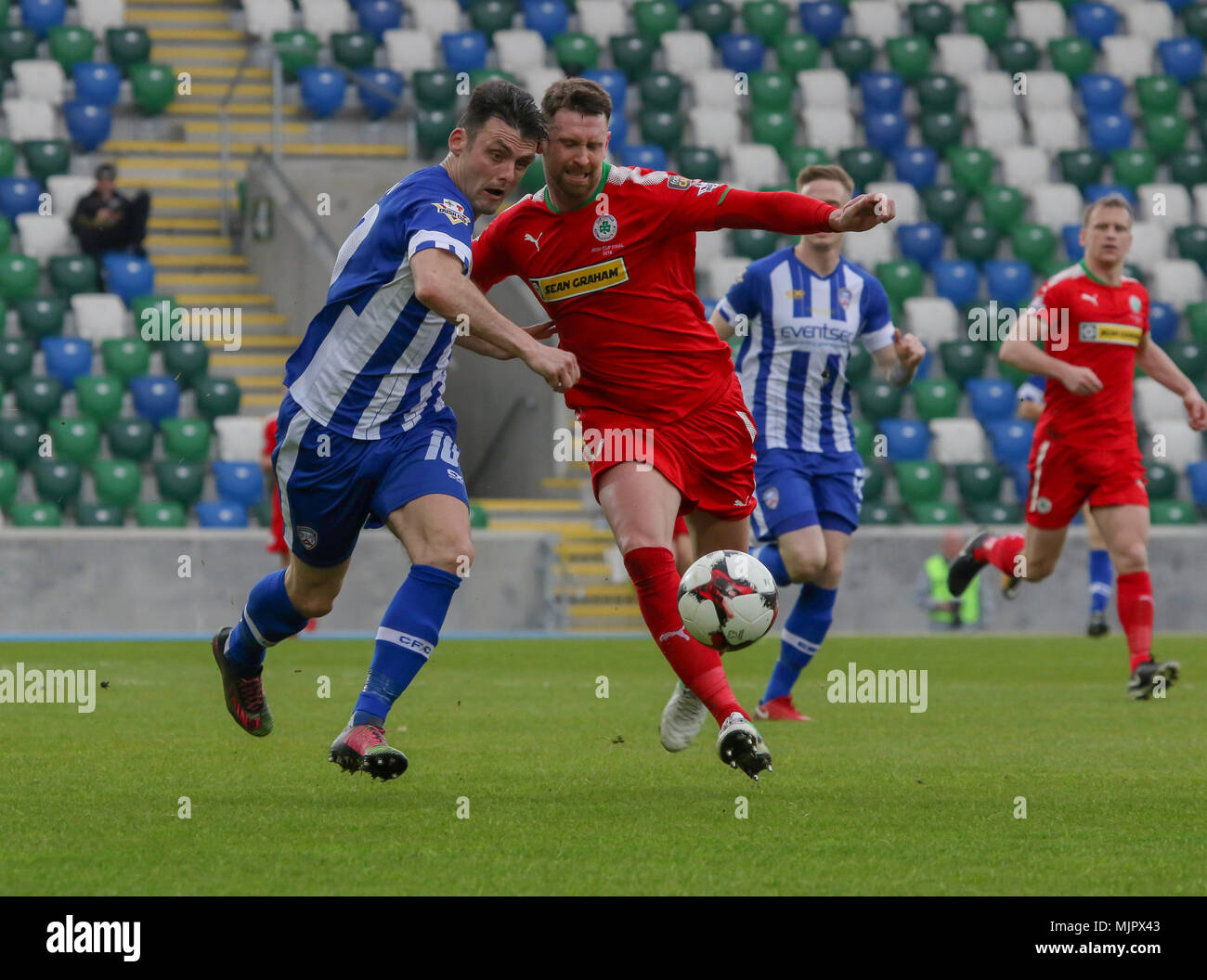Belfast, Northern Ireland, UK, 5 May 2018. National Football Stadium at Windsor Park, Belfast, Northern Ireland. 05 May 2018. Tennent's Irish Cup Final - Cliftonville 1 Coleraine 3. Coleraine's Eoin Bradley (left) and Cliftonville's Garry Breen battle for the ball. Credit: David Hunter/Alamy Live News. Stock Photo