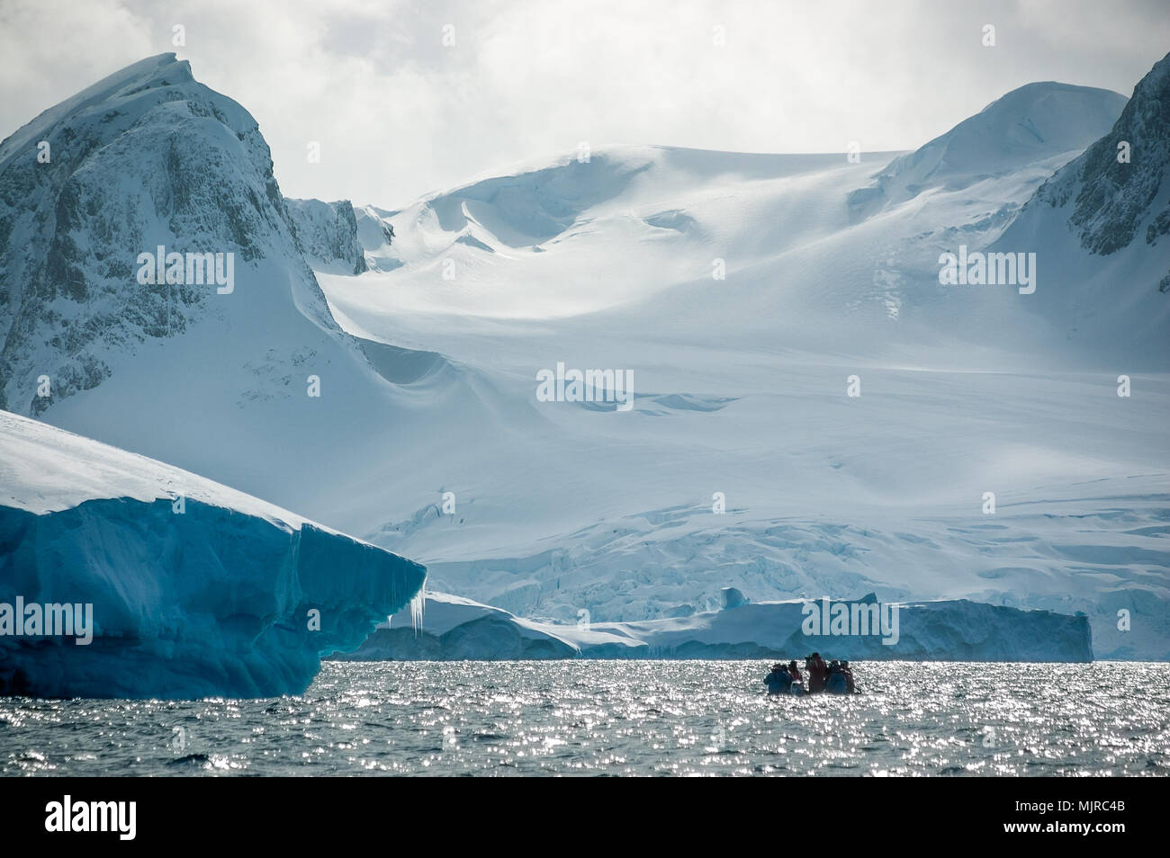 Small group of ship passengers out on Zodiac in Penola Strait get close