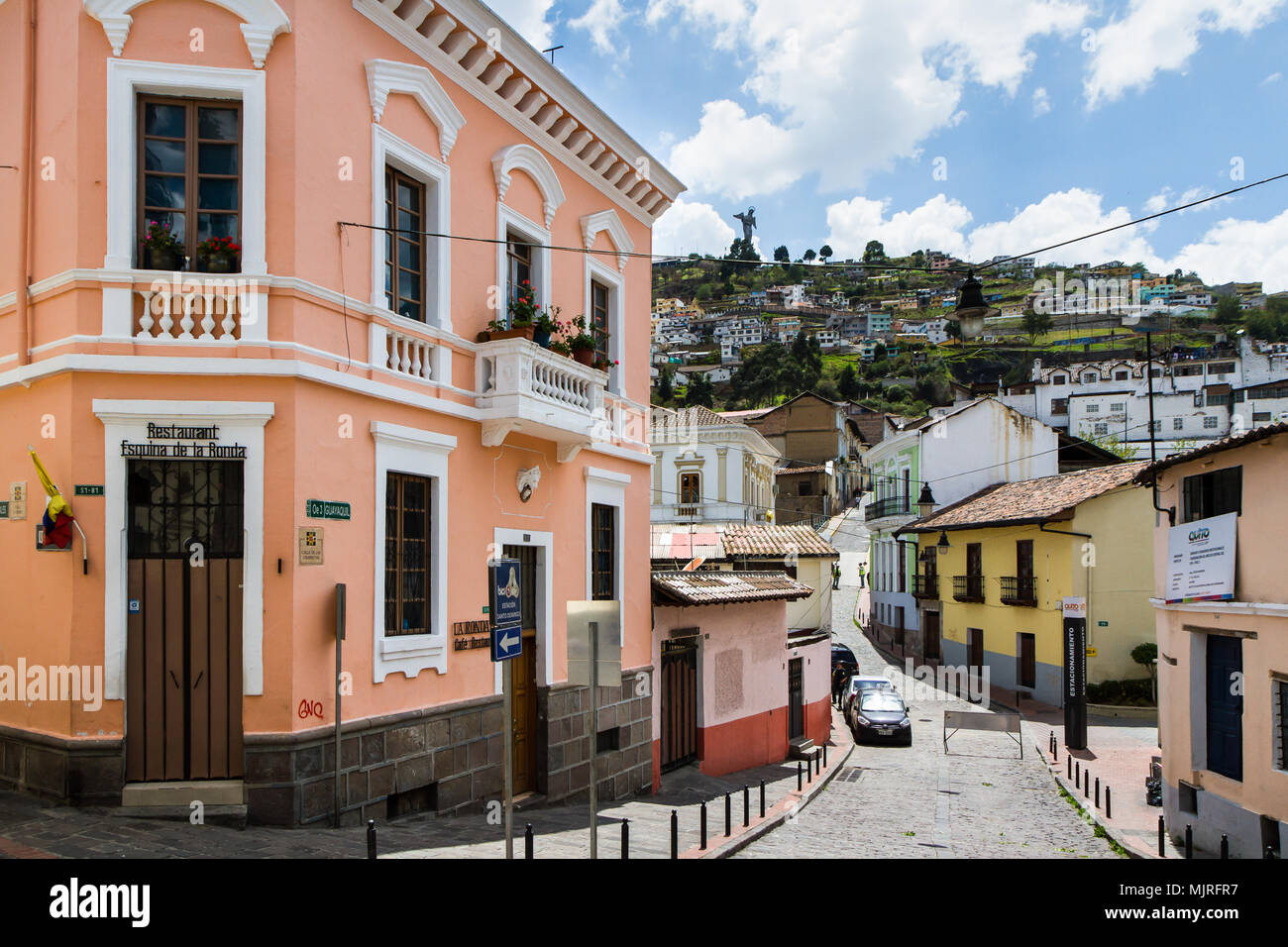 QUITO, ECUADOR - OCTOBER 27, 2015: A typical street scene in the colourful La Ronda area of historic Quito, Ecuador with the famous winged Virgin Mary Stock Photo