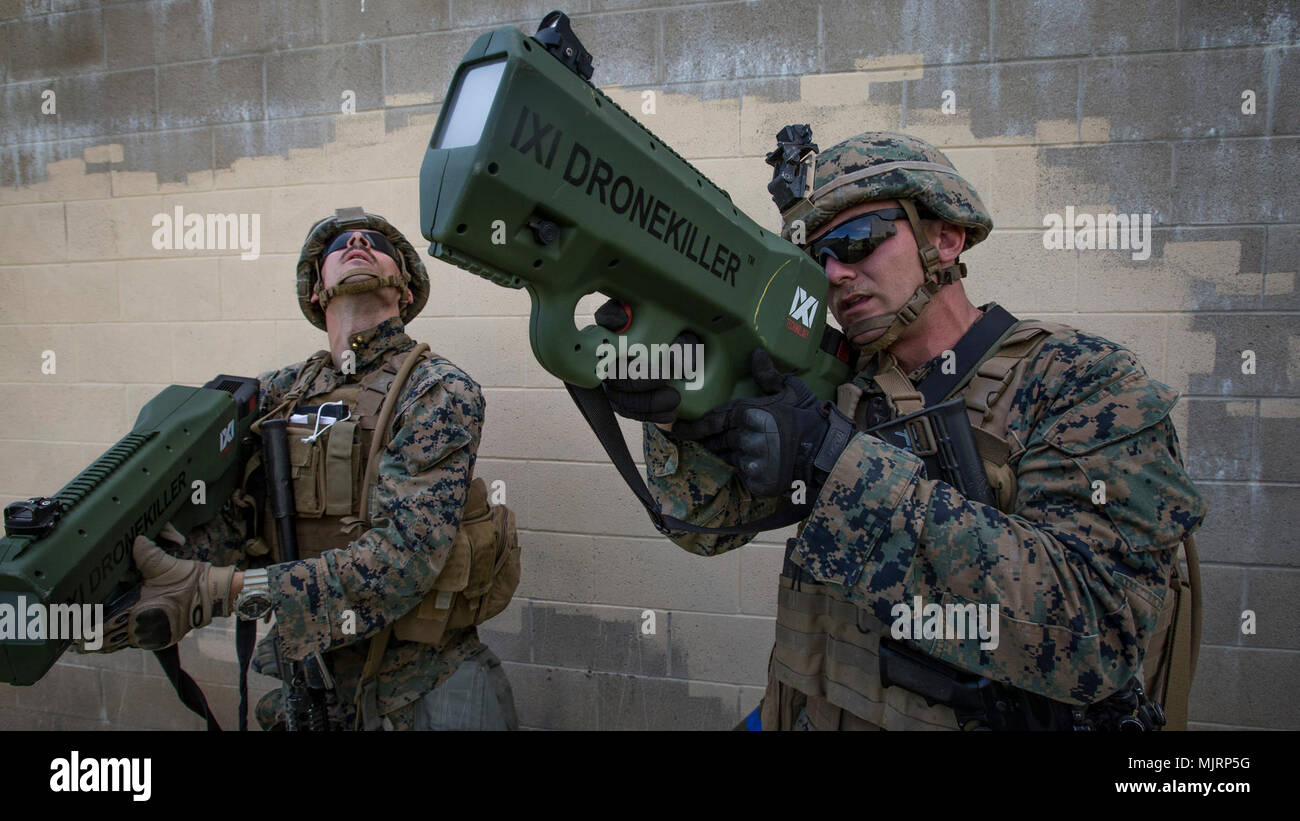 U.S. Marine Corps Lance Cpl. Briar Purty, an infantryman with 3rd Battalion, 4th Marine Regiment, 1st Marine Division tests Drone Killer Counter-UAS Technology during Urban Advanced Naval Technology Exercise 2018 (ANTX-18) at Marine Corps Base Camp Pendleton, California, March 21, 2018. The Marines have been provided the opportunity to assess the operational utility of emerging technologies and engineering innovations that improve the Marine’s survivability, lethality and connectivity in complex urban environments. Armed Forces and civilians displaying courage bravery dedication commitment and Stock Photo