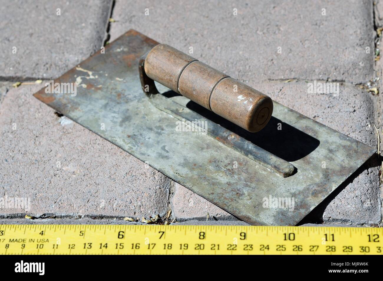 Trowel on paver bricks Stock Photo Alamy