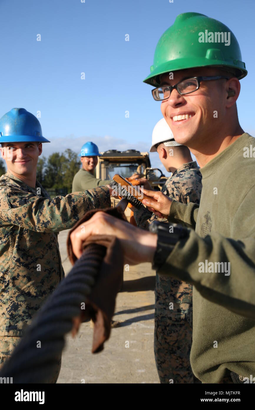 On Dec. 28, 2017, a Marine assigned to Engineer Support Company performed cleaning and lubrication of a winch cable at Camp Hansen, Okinawa, Japan, during scheduled preventative maintenance prior to the New Year period. The archival image records maintenance procedures on base equipment. Stock Photo
