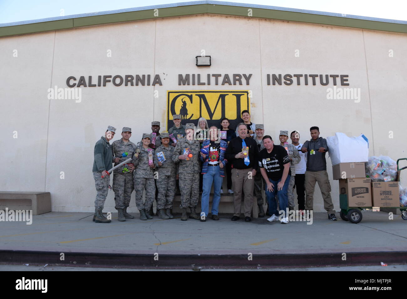 U.S. Air National Guard Airmen pose for a group photo with faculty and