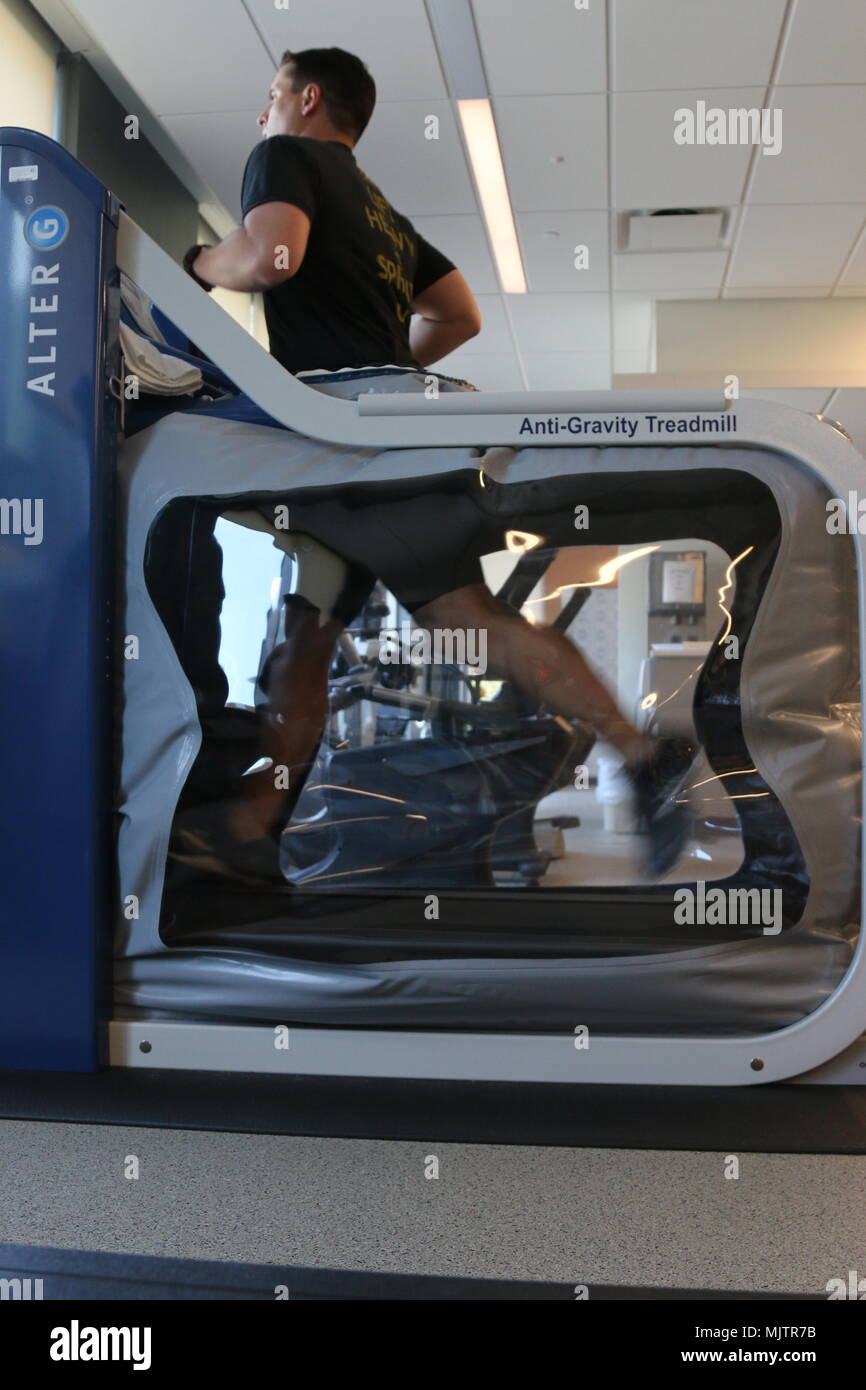 A patient at the Intrepid Spirit on Fort Bragg, N.C., runs on the Alter ...