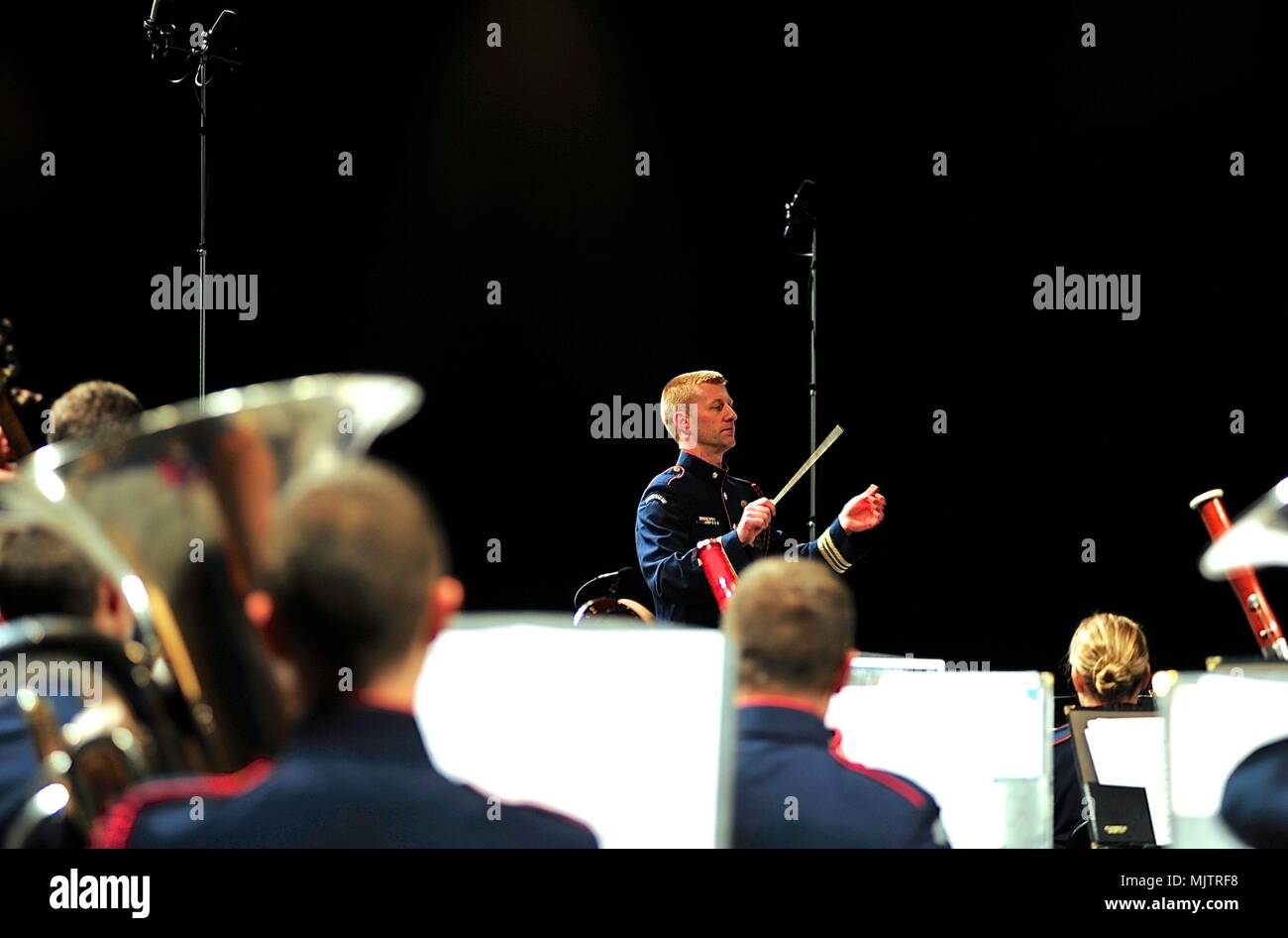 Lt. Cmdr. Adam Williamson conducts the Coast Guard Band during a