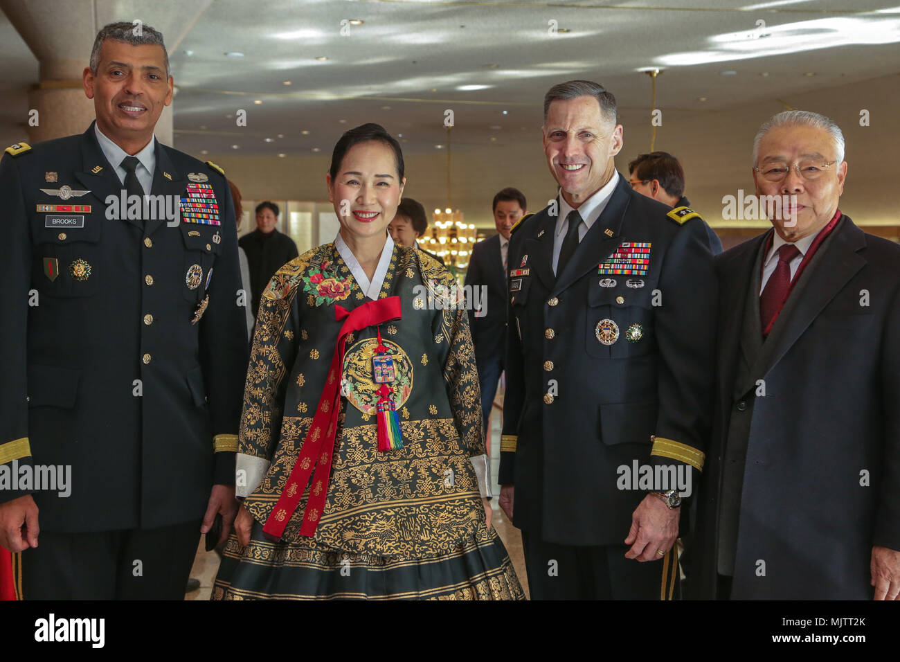 U.S Army Lt. Gen. Thomas S. Vandal, commander of Eighth Army, and Gen. Vincent Brooks, commander U.S Forces Korea, pose with community leaders before the Holiday concert in Seoul, Korea Dec. 17, 2017. The concert was hosted by the Eighth Army command in conjunction with local community leaders during the holiday season to promote harmonious relations between the U.S. Army and the Republic of Korea (ROK). Over 1500 U.S. Soldiers and ROK soldiers attended performances by the Eighth Army Band and the Prime Philharmonic Orchestra . (U.S. Army photo by Pfc. Edward Randolph) Stock Photo