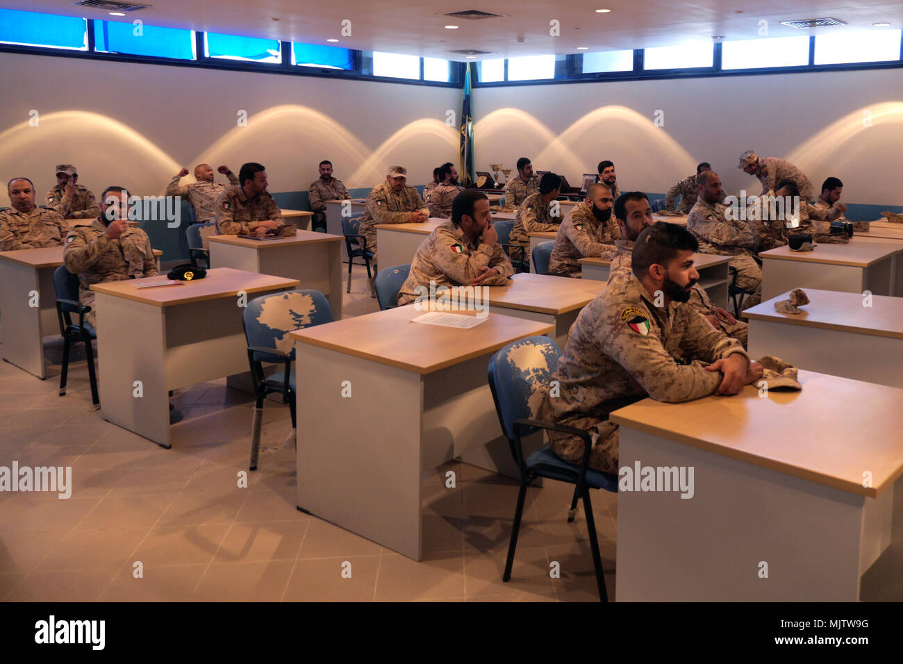 Twenty-seven Kuwaiti Marines gathered in a classroom at the Kuwait Naval Institute to attend the Tactical Resupply Subject Matter Expert Exchange with U.S. Marines from the Command Element and Logistics Combat Element, Special Purpose Marine Air-Ground Task Force – Crisis Response – Central Command. Exchanging logistic concepts and best practices allowed participants to learn from each other and strengthened relationships. Stock Photo