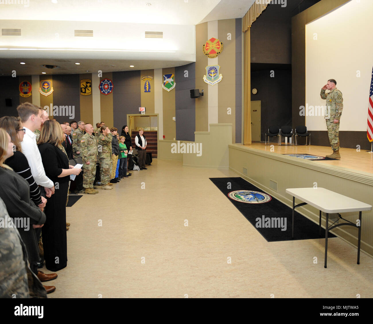 At the close of the Change of Responsibility Ceremony for the Joint Base Lewis McChord Garrison Headquarters, Incoming Garrison Command Sergeant Major CSM Kenneth Claybor salutes JBLM Garrison Headquarters Commander Colonel Nicole Lucas,. Stock Photo