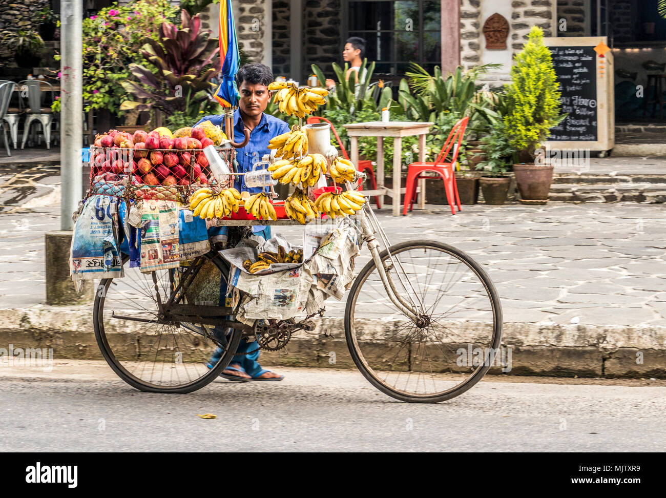 Mobile vendor on cycle selling fruit in Pokhara Nepal Stock Photo Alamy