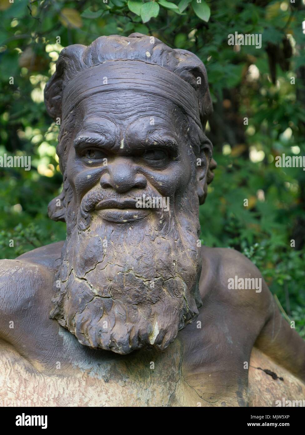 Beautiful, evocative, energetic bronze and stone garden statuary in formal garden setting at Forest Glade Gardens in Mt Macedon, Australia. Stock Photo