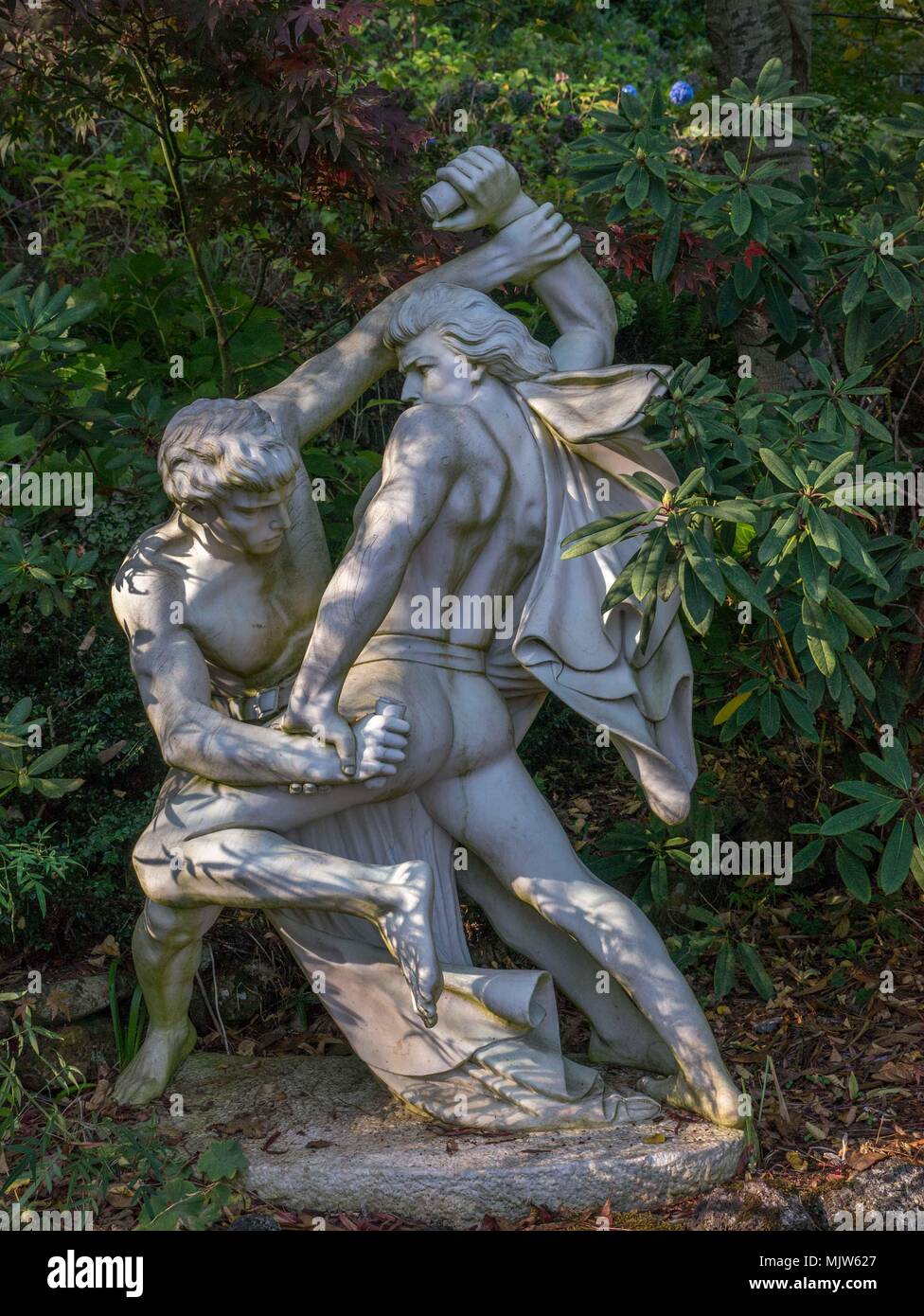 Beautiful, evocative, energetic bronze and stone garden statuary in formal garden setting at Forest Glade Gardens in Mt Macedon, Australia. Stock Photo