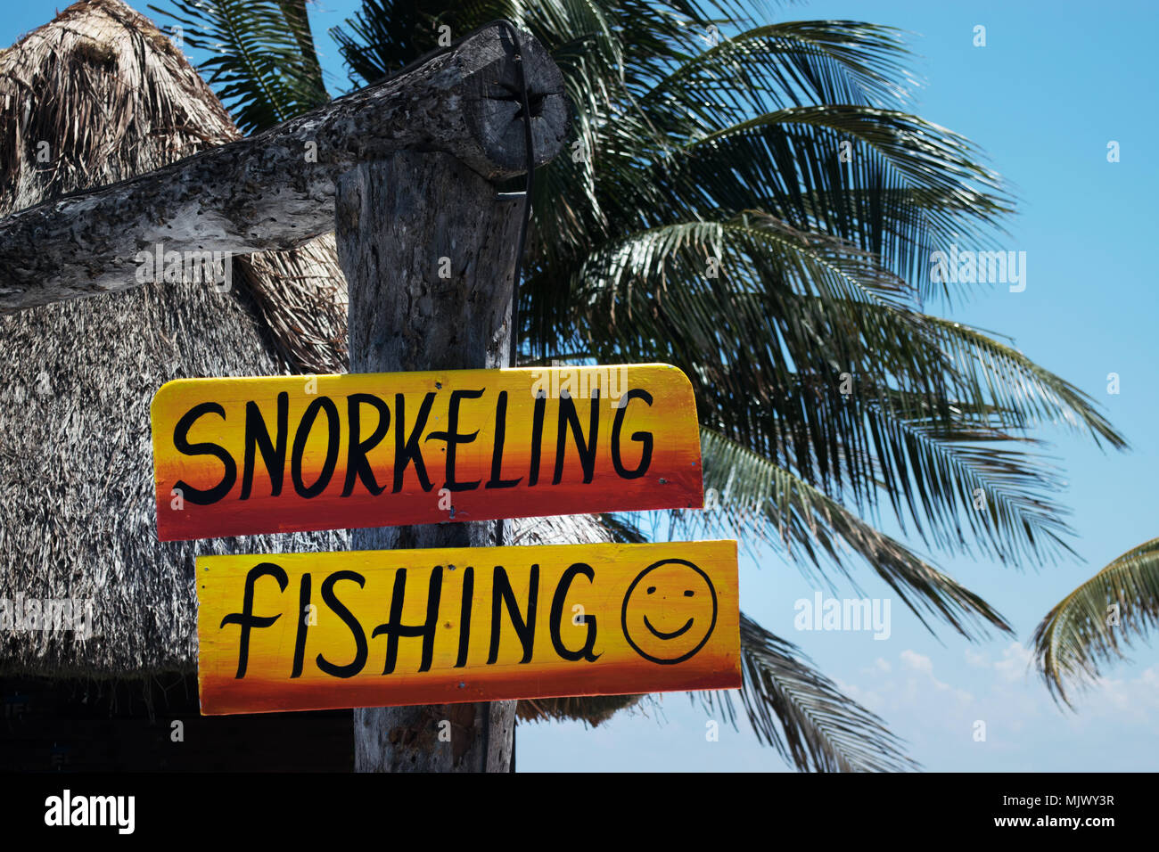 Snorkeling and fishing sign at tropical beach Stock Photo