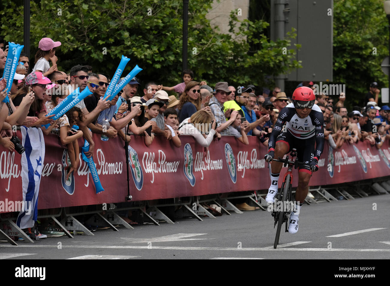 Colombian cyclist John Darwin Atapuma who rides for the UAE Emirates  professional cycling Team sprints as Israeli spectators cheer during the  101st Giro d'Italia, Tour of Italy in the 1st stage which