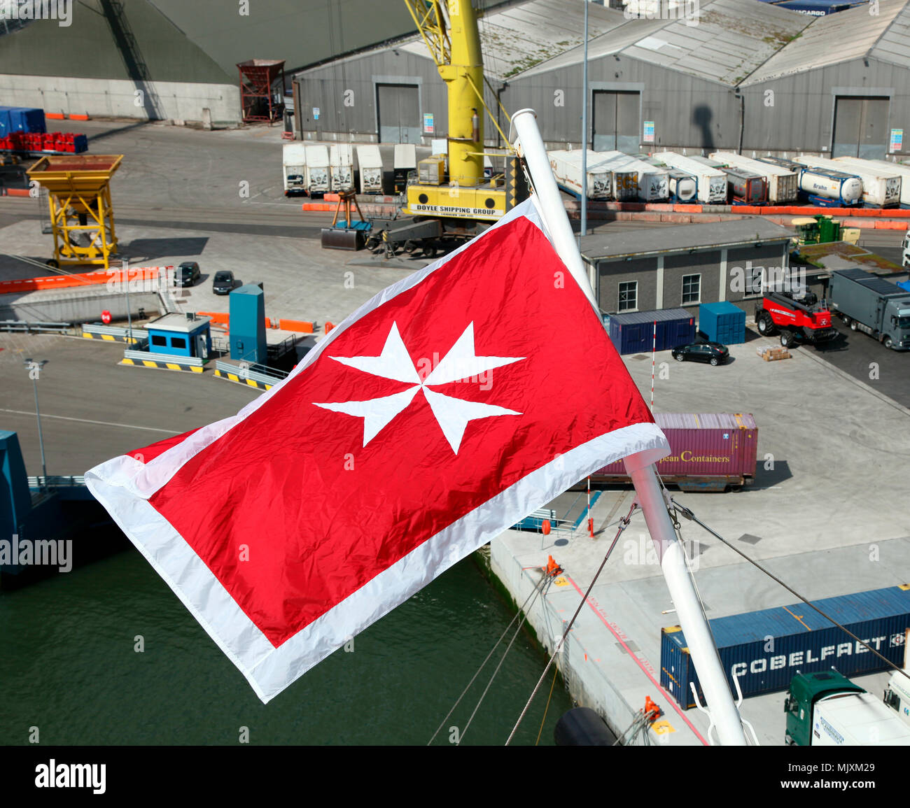 The civil ensign of Malta flying on Celebrity Eclipse, Dublin Port, Ireland Stock Photo