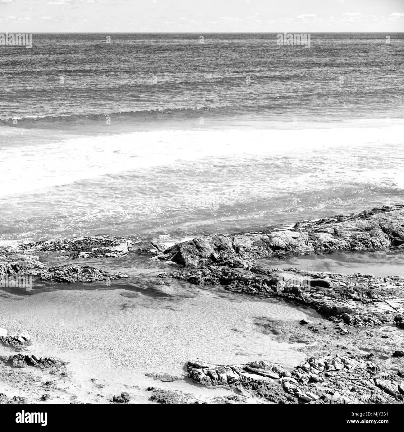 in  australia fraser island the beach near the rocks in the  wave of ocean Stock Photo