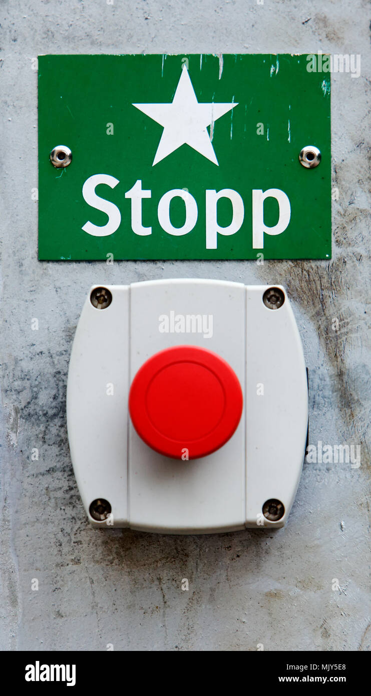 Red Swedish emergency stop button and sign. Stock Photo