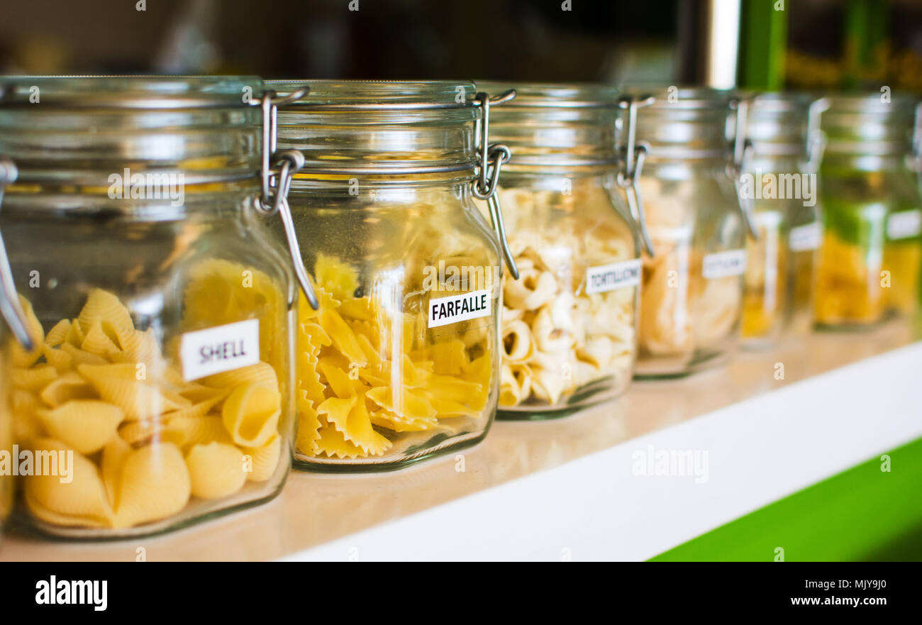 Various raw pasta selection in labeled jars Stock Photo Alamy
