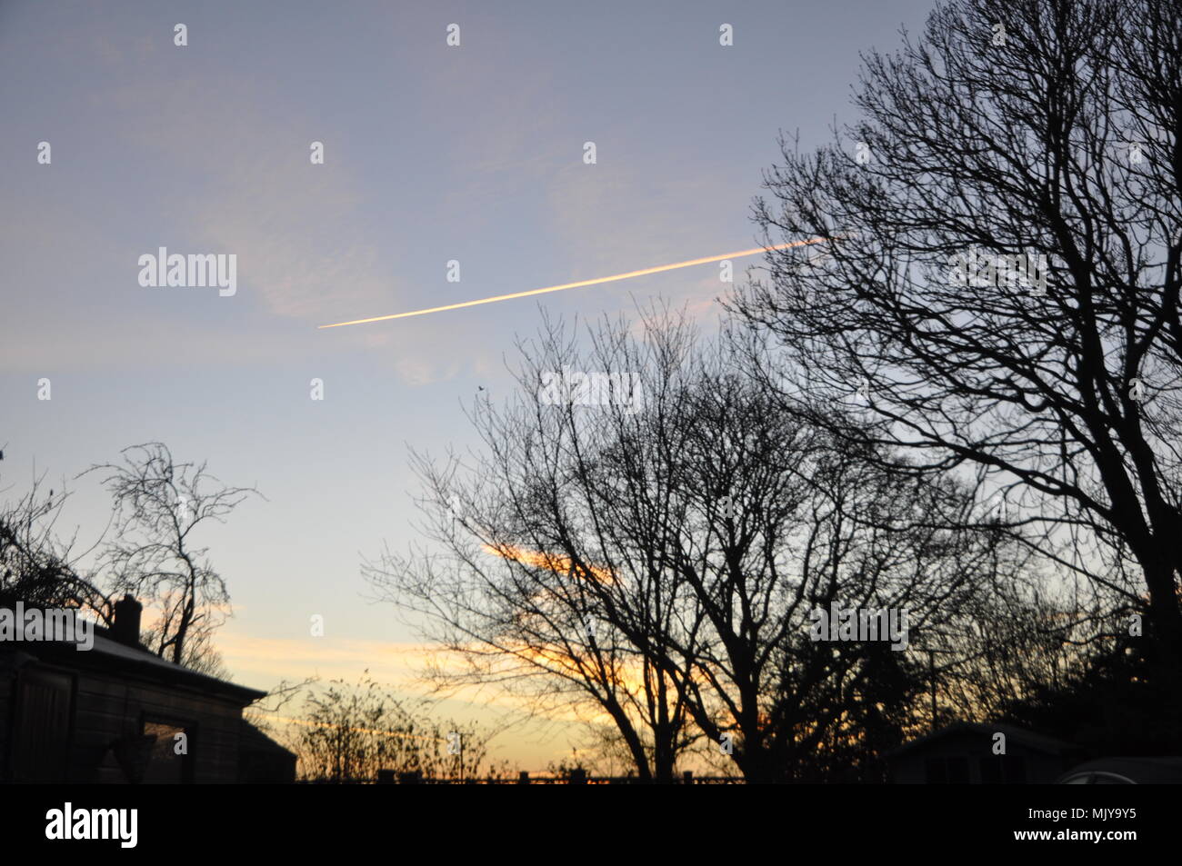 vapour train in early morning sky Stock Photo