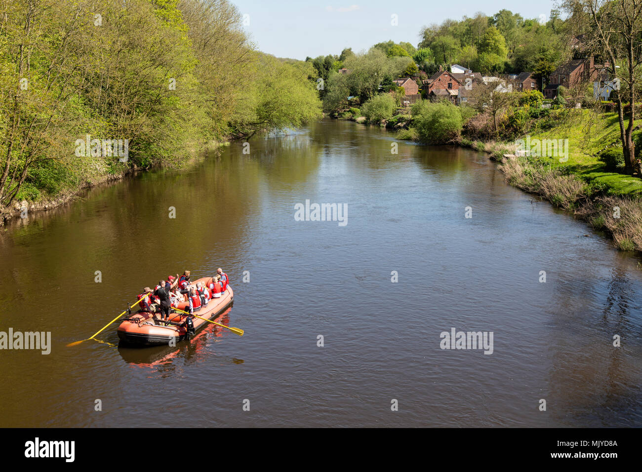 The River Severn in Jackfield, Shropshire, England, with a rigid inflatable boat full of passengers. Stock Photo