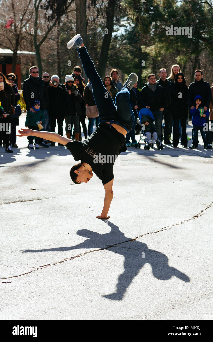 Breakdancer doing a hand stand on the streets of Madrid, Spain Stock Photo