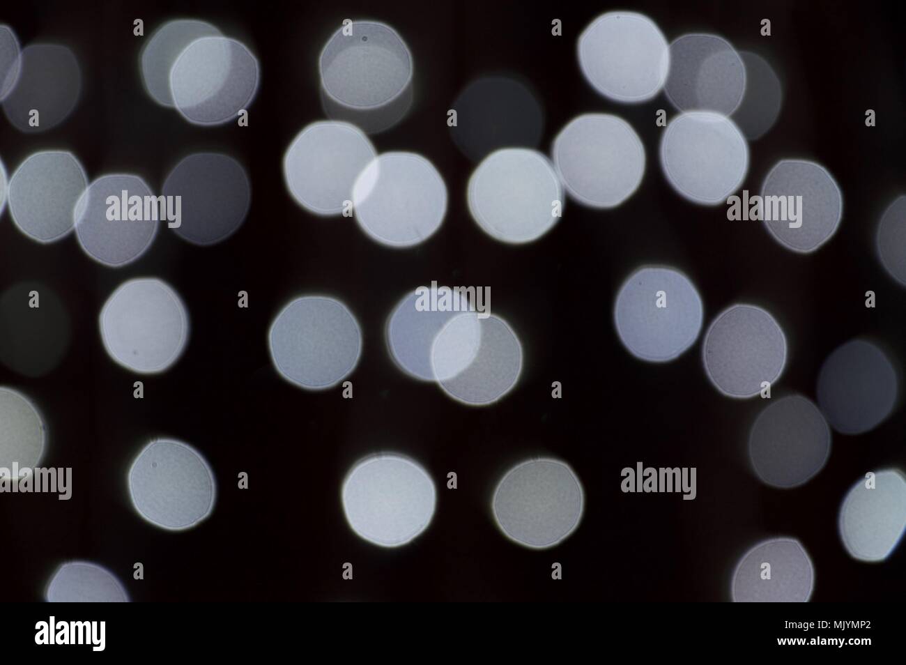 White Lights With Bokeh Effect On Dark Background Stock Photo Alamy