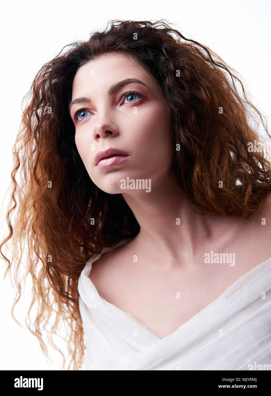 Close-up portrait of the beautiful young woman with curly hair Stock ...